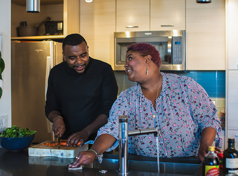 Couple washing dishes